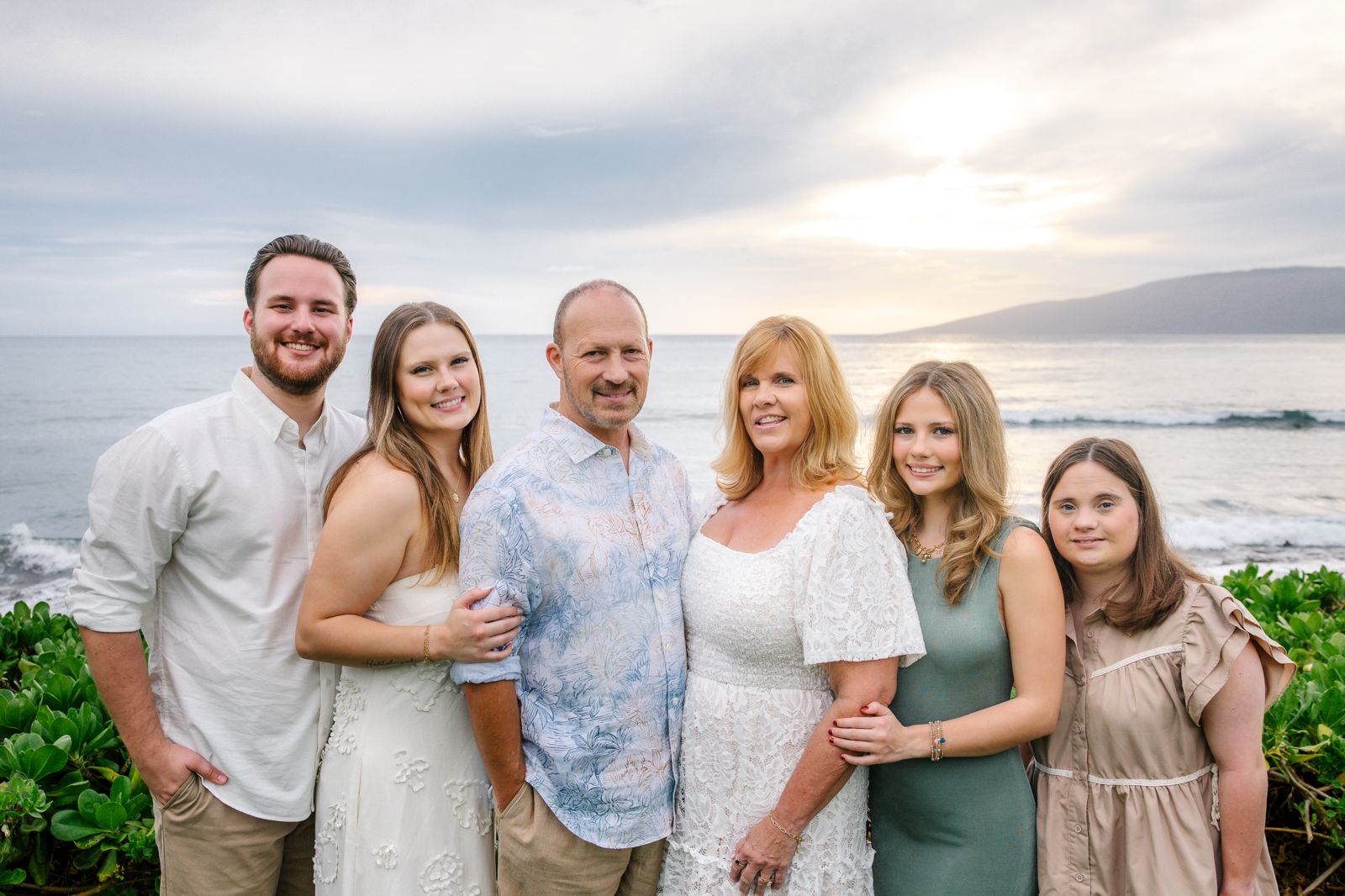 Family of six at sunset on Maui shore